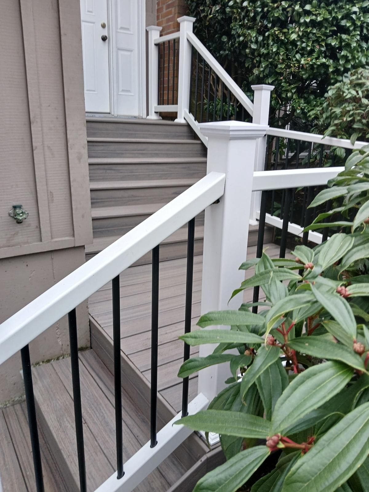 Decking — composite stairs with white railing
