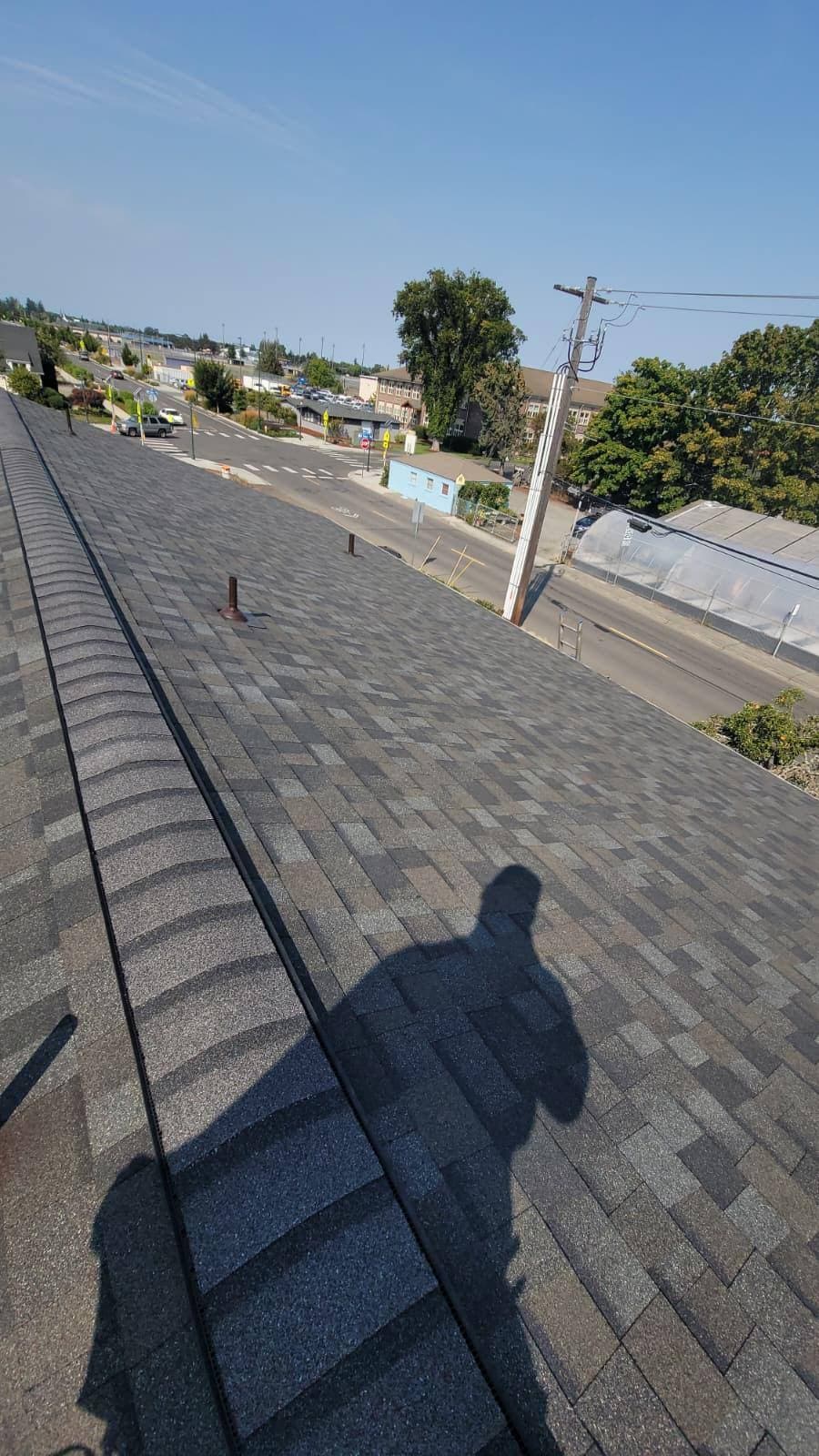 Completed asphalt shingle roof — full tear-off and re-roof